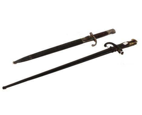 A 19th century bayonet and scabbard, possibly French, the scabbard with a leather coating, together with a bayonet and scabba