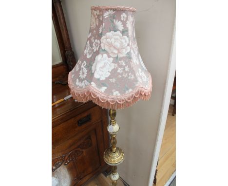 A standard lamp, brass and onyx type 