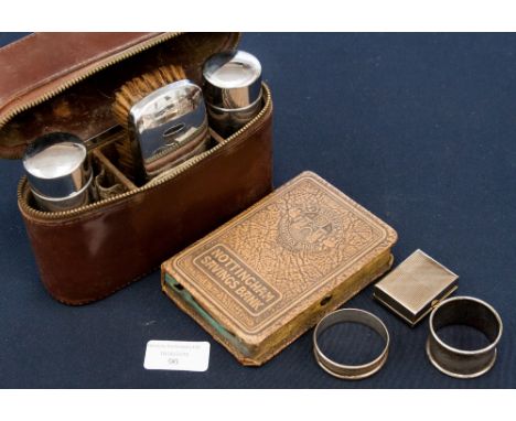 A silver napkin ring, a pair of mother of pearl cufflinks, a chrome plated leather cased travel set, pill box and an EPNS nap