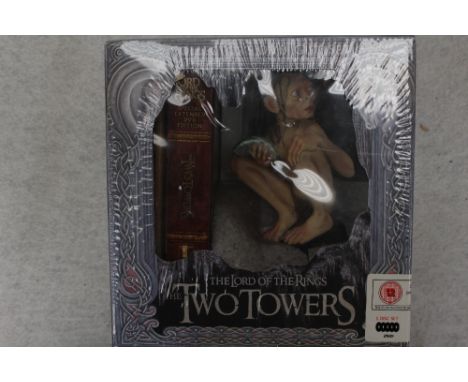 The Lord of the Rings 'The Two Towers' collectors DvD gift set, complete with figure, fitted with original box