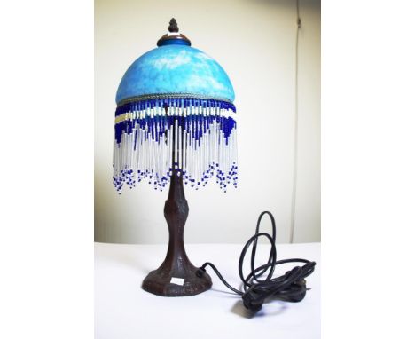 Bronzed table lamp with glass shade bronzed lamp base, fitted for electricity, embossed decoration, blue glass shade, with su