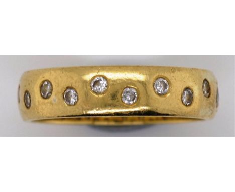 Diamond set 18ct gold ring with 20 punch set round brilliant cut diamonds One stone A/F gold marks partially obstructed  appr