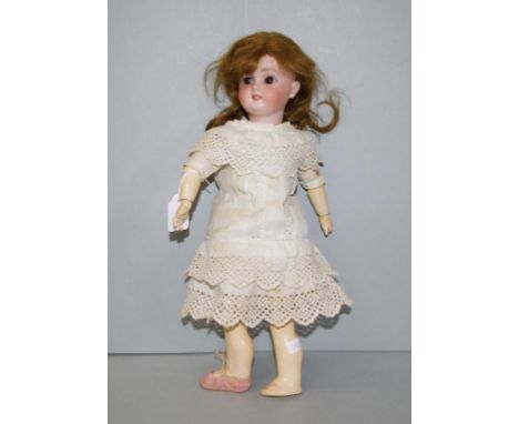Vintage Simon Halbig Germany ceramic doll sleeping eyes, jointed limbs, dressed, with original wig. Height Height 35cm approx