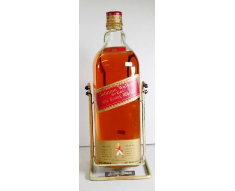 4.5 Litre bottle of Johnnie Walker scotch whisky on metal pouring stand, Red Label, (height 47cm approx).