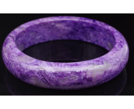 "Purple dragon"  gemstone bangle. Natural Charoite, lavender colour approx 56mm inside diameter, 8.6mm gauge d end shape. Cer