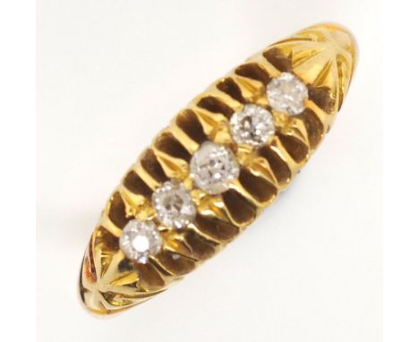 Antique 18ct gold diamond ring Set with five old cut diamonds, in a raised c shape claw setting. Decorated in high relief wit
