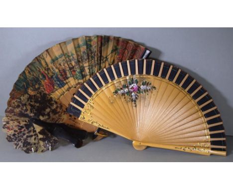 Three various vintage fans to include a tortoiseshell fan, a wooden floral fan and traditional Spanish scene fan