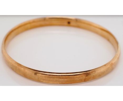 Early 20th c. gold armlet bangle Marked wax filled Approx 15 grams total weight, 8mm thick, 3.4mm gauge d shape hollow tube. 