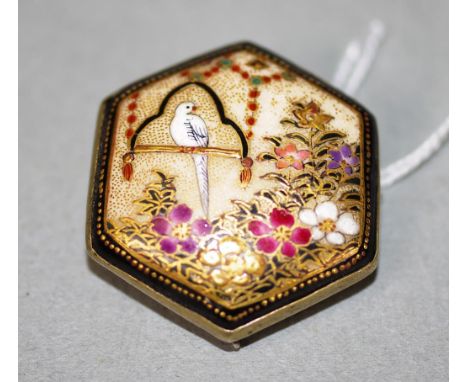 Japanese Satsuma ceramic brooch floral and gilt decoration, bird on a swing, silver backing. (Diameter  3cm approx.)