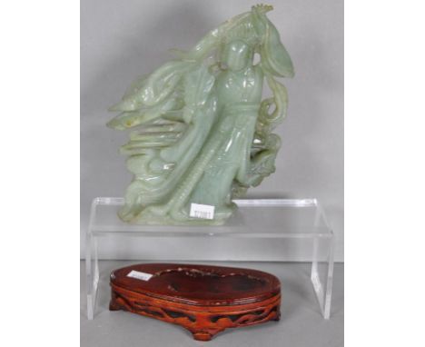 Carved Jade Chinese deity figure 19cm high & a non-matching timber stand