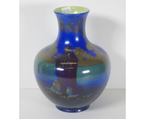 Vintage Royal Doulton mantle vase figural decoration of a Middle Eastern man in a landscape, on blue ground. Marked to base a