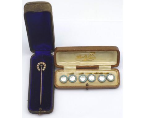 Antique gold and seed pearl stick pin. Horse shoe design in box. Approx 4.57 grams weight. As well as some gilt metal and ena