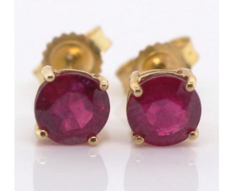 Ruby and 10k gold stud earrings. Marked 10k. Approx 2x 4.5mm round cut rubies