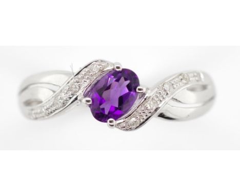 Amethyst, diamond and 9ct white gold ring. Marked 375 approx 6x4mm oval cut amethyst, ring weight 2.3 grams, ring size S.