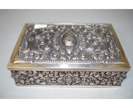 Vintage Indonesian silver cigarette box decoration in relief to lid and sides, wood lined interior, marked ZN/800 to base. In