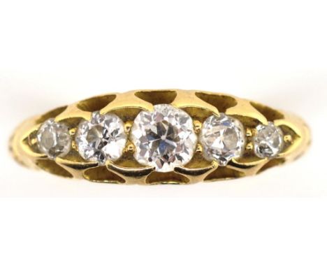 Antique diamond and 18ct gold ring. Five stone elevated claw set  Old European cut graduating diamonds. With scroll grooved c