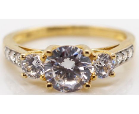CZ and gold ring Marked 9k approx 2.7 grams weight, ring size M.