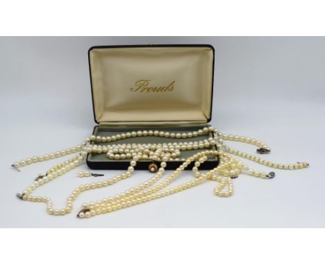 A collection of vintage pearl necklaces Includes six strands of graduated pearl necklaces, one with a 9ct clasps . Some restr