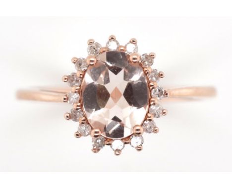 Morganite, diamond and rose gold ring. Marked 10k  Approx 6x8mm oval cut Morganite, 17x round brilliant cut diamonds . Total 