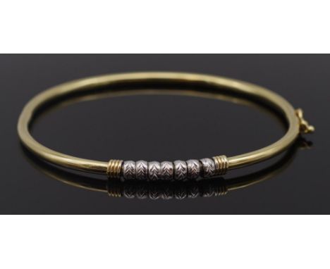 Hinged 9ct yellow and white gold bangle marked 375 and tested, weight: 4.85g