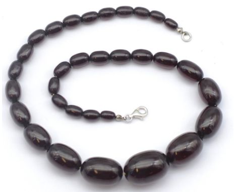 Vintage graduated amber bead necklace. Dark cherry colour, approx 9mm x 6mm - 20mm x 27mm size beads, total length, 50cm leng