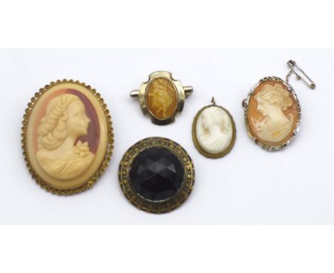 Group of brooches. Includes vintage cameos and a antique piece.