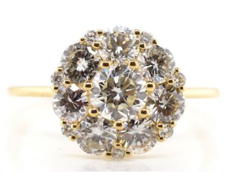 18ct gold and diamond cluster ring Pronged set daisy cluster marked 18k 750 approx round brilliant cut diamonds 7= 1.08ct, 7=