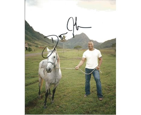 Dwayne The Rock Johnson 10x8 signed colour photo. Dwayne Douglas Johnson (born May 2, 1972), also known by his ring name The 