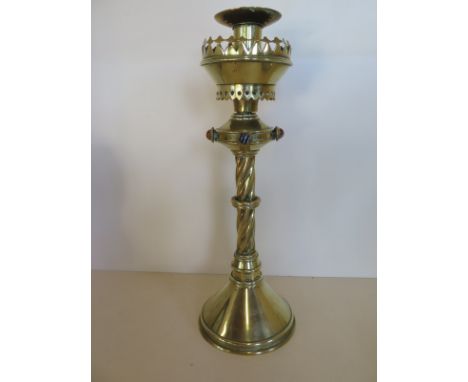 A Pugin design brass candle stick with agate roundels, 39cm H, some bending but generally good 