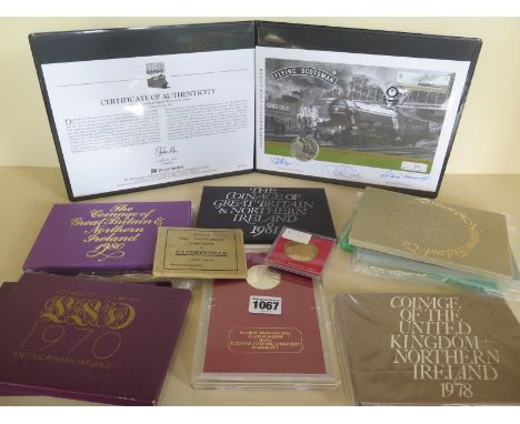 A limited edition silver £5 coin and signed first day cover set of the Flying Scotsman together with nine sets of Coinage of 