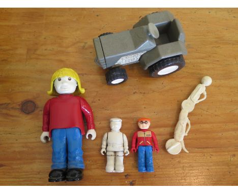 A collection of pre-production Britains Small World figures and a tractor, the tractor made from aluminium resin separates in