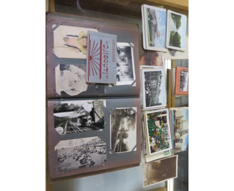 A collection of Vintage postcards in an album and loose 
