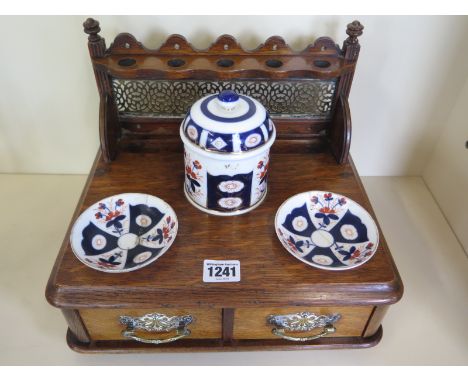 An oak smokers box with ceramic tobacco pot and dishes - 24cm H x 30cm x 24cm - dishes have been repaired, otherwise good 