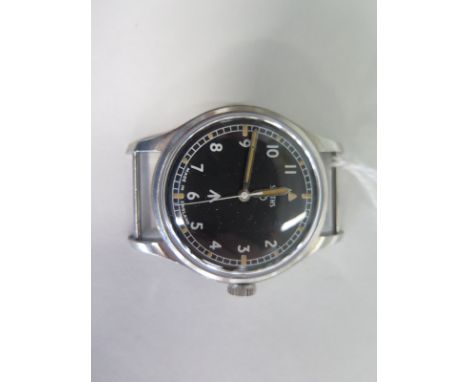 A military issue Smiths W10 watch head with broad arrow markings, hacking function and Arabic dial, please see images for ser