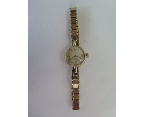 A ladies Rotary manual wind wrist watch on a hallmarked 9ct gold strap - running, some usage wear, total weight approx 17.5 g