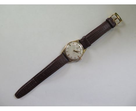 A Vintage gents Omega 9ct manual wind wristwatch, 35mm wide including button - in clean working order, some wear to back cove