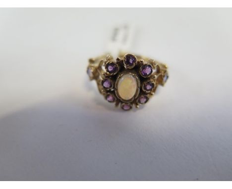 A hallmarked 9ct yellow gold opal and amethyst ring, size N, approx 3.3 grams, new condition, ex jewellers stock 