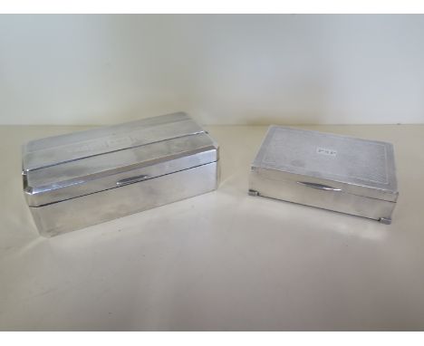 Two silver desk cigarette boxes, largest 17cm x 9cm x 5cm - both generally good 