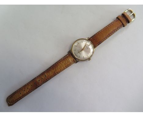 A Garrard 9ct yellow gold manual gents wrist watch - 34mm wide including button - clean running order 