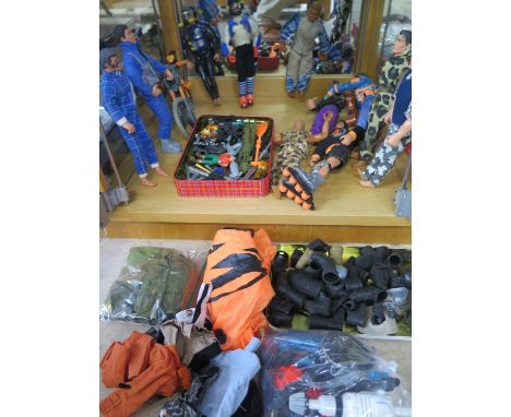 A collection of 10 Action man figures, clothing and accessories, and an X figure, one missing a leg 