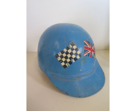 A vintage circa 1950s racing helmet bearing the label ‘Carburton Safety Helmet S. Lewis, .. Carburton St. London’ with turquo