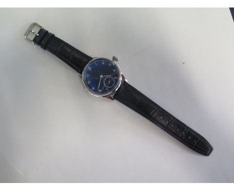 A large manual wind pilots type watch - 44mm without crown - stainless steel case with large screw-on see-through back - Blac