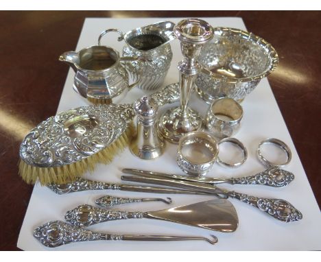 A collection of various silverwares, two silver milk jugs, a sugar bowl, four napkin rings, approximately 10.2toz, together w