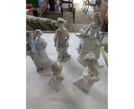 Five Lladro figurines, including a  group of a bride and groom, largest 25cm high, two of the figurines have chipped fingers 