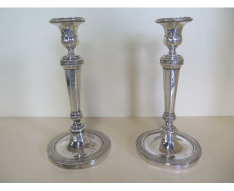 A pair of 19th century continental candlesticks, with rubbed hallmarks possibly Austrian, with filled supports, overall appro
