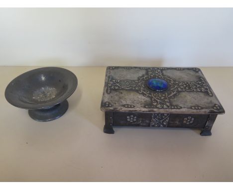 An Arts and Crafts style pewter trinket box, approximately 19.5cm wide and inset with an oval blue enamel centre piece togeth
