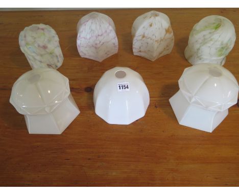 Seven early 20th Century glass lamp shades, including four mottled and three opaque, in good condition, apart from slight chi