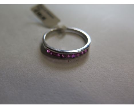 A 9ct white gold ruby ring marked 375, size N, approx 1.3 grams, ex jewellers stock, as new condition 