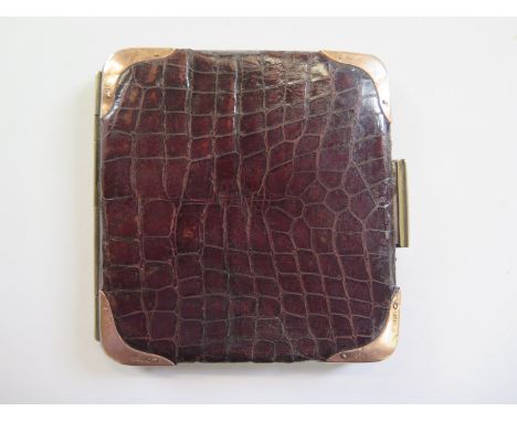 A Vintage crocodile skin wallet with 9ct gold corners, this stylish wallet is 10cm x 10xm - the corners are 9ct hallmarked go