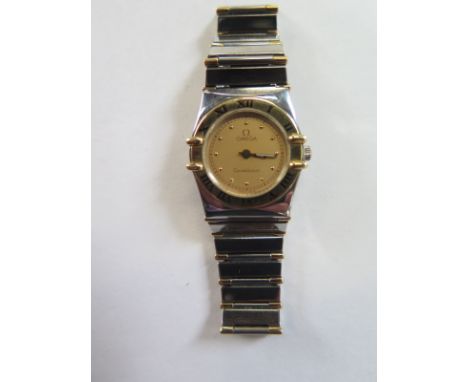 A ladies bi metal Omega Constellation quartz wristwatch, 24mm wide including button - in good clean working order - no 6148/4